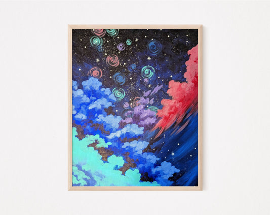A framed art print showing a night sky with swirling clouds in shades of pink and blue filled with glowing stars and spirals