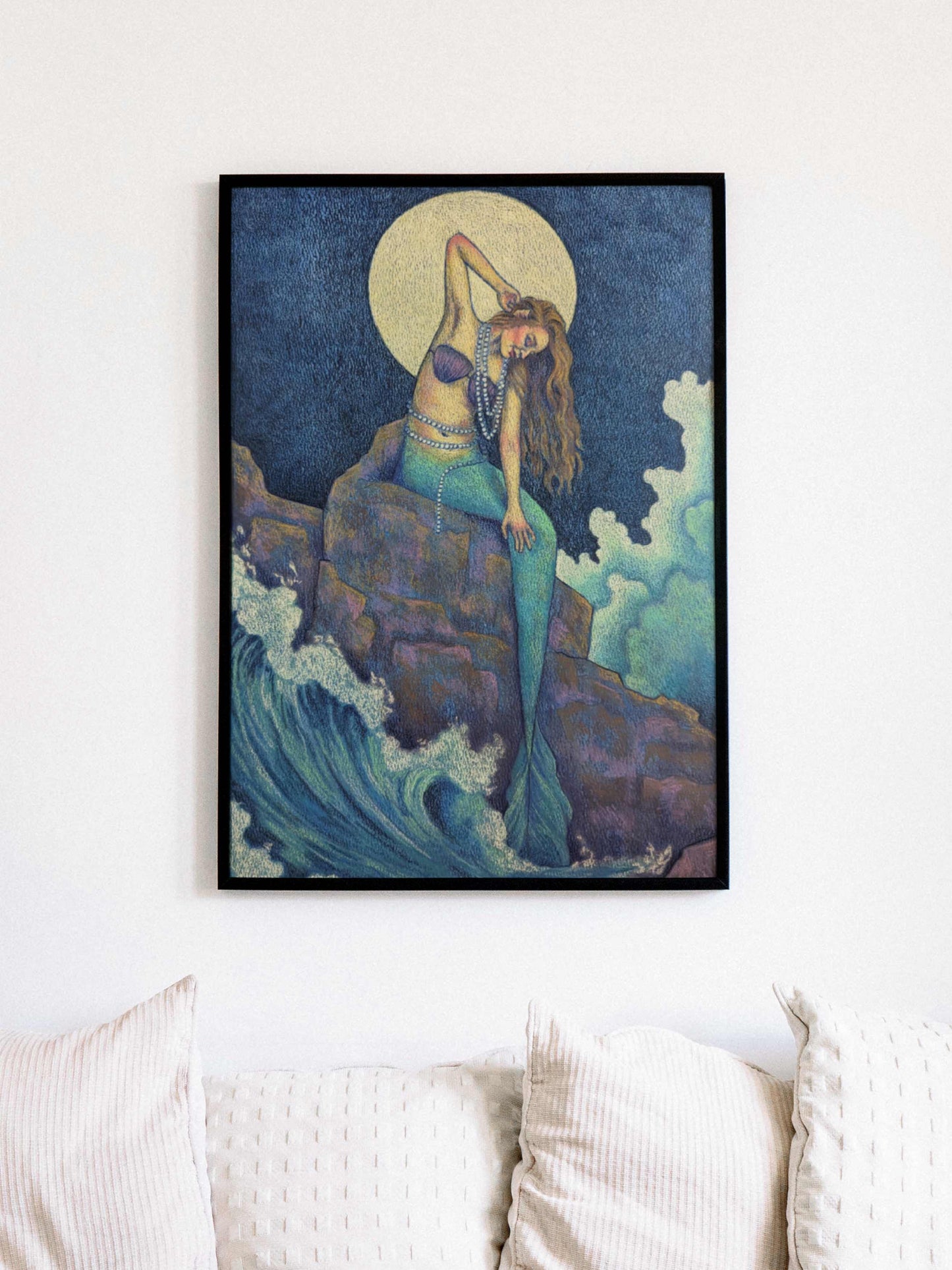 Art print depicting a mermaid resting on a rocky shore, gazing out over waves under a full moon