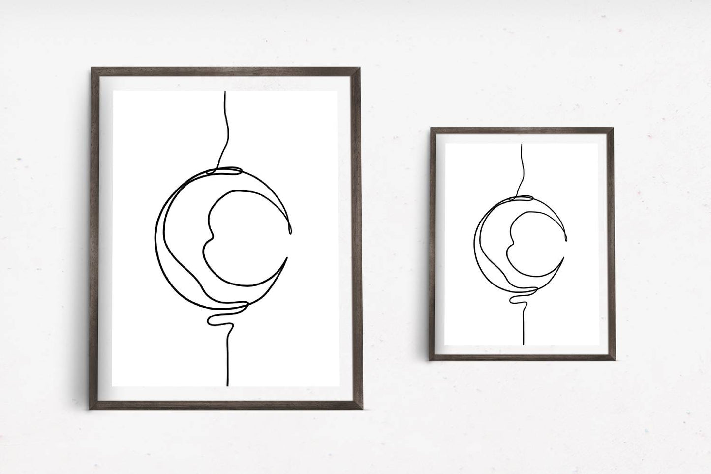Art print with a minimalist black line drawing of a crescent moon creating an artistic representation of the moon's shape