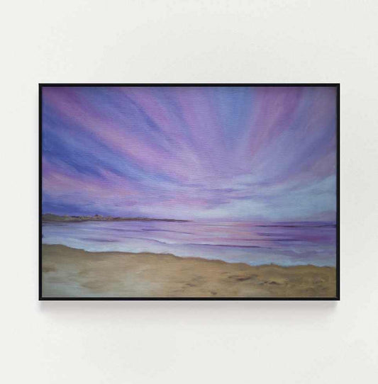 Art print of a beautiful purple sunset over a tranquil beach with soft purple, navy and pink hues in the sky