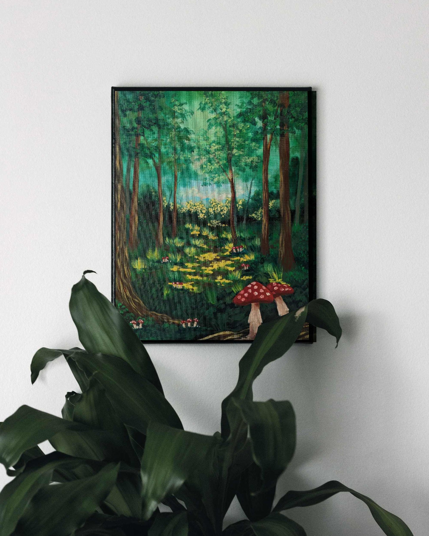 Art print showcasing a fairy forest scene with two red mushrooms in the foreground, tall trees and sunlit foliage