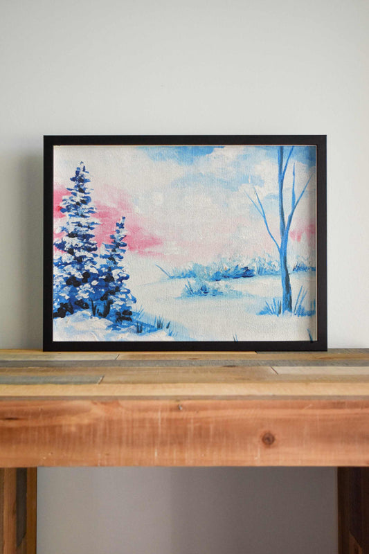 A wintry landscape art print with snow-covered trees and soft pink and blue hues in the sky