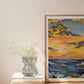 Art print of vibrant sunset over the ocean with waves gently crashing onto the shore decorated with golden clouds in the sky