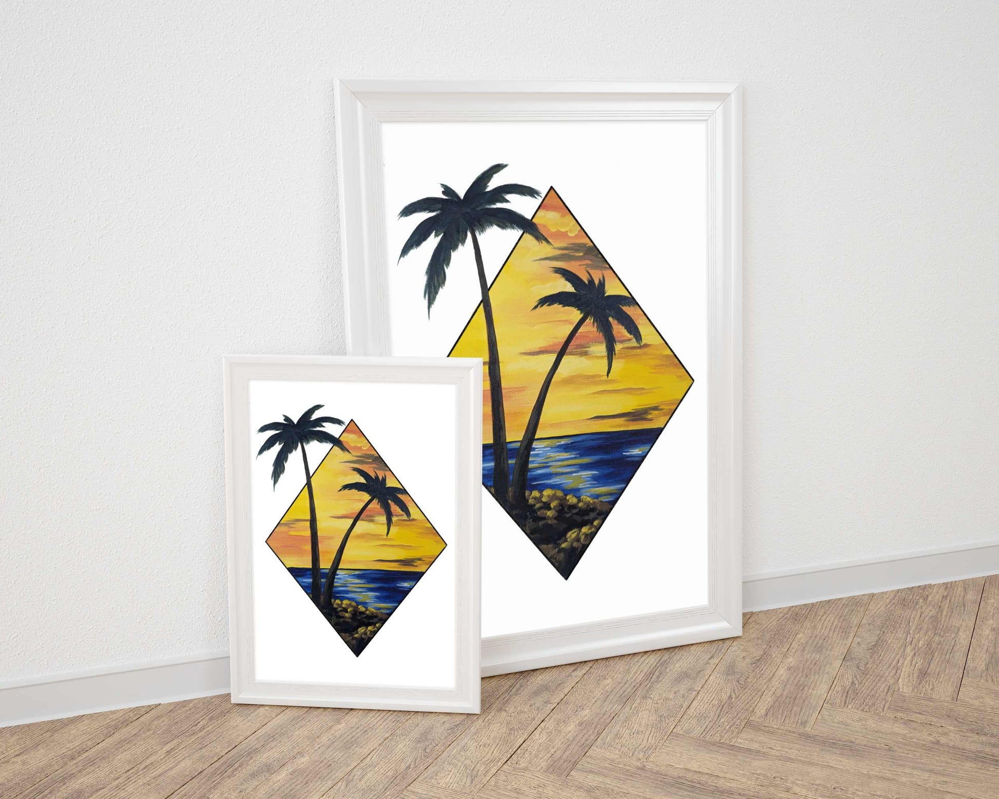 Framed art print featuring a scenic view of two palm trees by the water at sunset