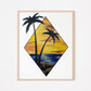 Framed art print featuring a scenic view of two palm trees by the water at sunset