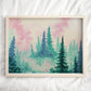 A framed forest art print of tall pine trees fading into the mist set against a pastel pink and blue sky