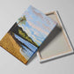 Canvas art print featuring a serene Hawaii beach with palm trees, gentle ocean waves, and distant mountains under a pastel sky