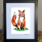 A playful art print of a sitting red fox, doodled with a vibrant orange coat and green grass beneath it
