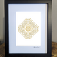 Art work featuring a detailed geometric mandala design in gold lines intricately layered to form a symmetrical pattern