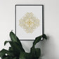 Art work featuring a detailed geometric mandala design in gold lines intricately layered to form a symmetrical pattern